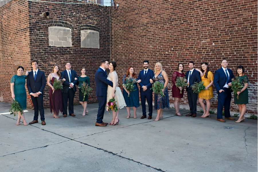 A wedding party pose in the city.